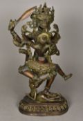 An Eastern cast bronze figure of a dancing deity With female attendant,