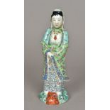 A 19th century Chinese famille verte porcelain model of Guanyin Modelled standing in flowing floral