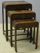 A late 19th/early 20th century Chinese hardwood nest of three tables The panelled top above the
