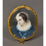 A 19th century miniature portrait on ivory Depicting a young lady in a blue dress with a white