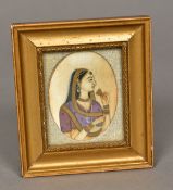 A 19th century Indian miniature portrait on ivory Depicting a bejewelled young lady,