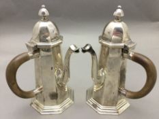 A pair of Victorian silver chocolate pots, hallmarked London 1868,