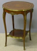 A parquetry and marquetry and brass mounted centre table The shaped circular top centred with a