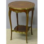 A parquetry and marquetry and brass mounted centre table The shaped circular top centred with a