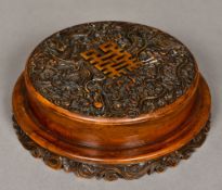 A Chinese carved hardstone box and cover Of circular section,