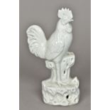 Three Chinese blanc de chine porcelain figures Comprising: a cockerel,