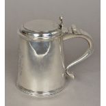 A William & Mary silver lidded tankard, probably hallmarked for London 1691,