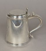 A William & Mary silver lidded tankard, probably hallmarked for London 1691,