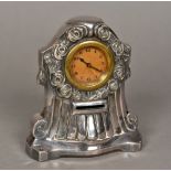 An early 20th century silver plated combination clock money box Of domed form with floral