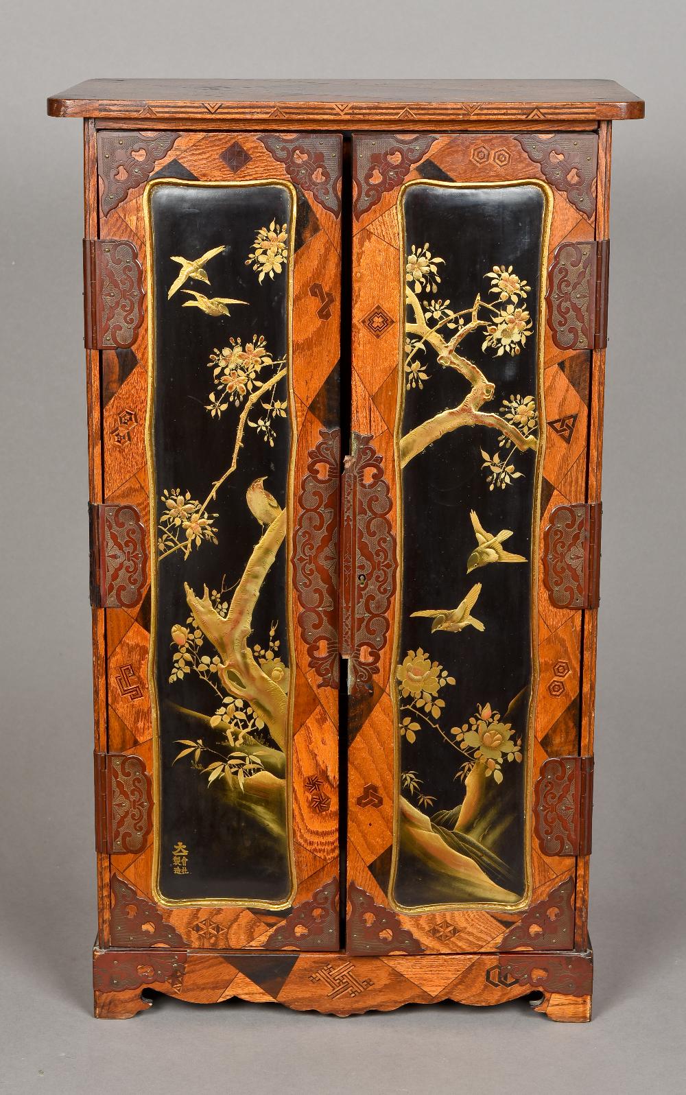 A fine quality 19th century Japanese lacquer and parquetry inlaid table cabinet The rounded