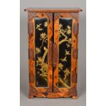 A fine quality 19th century Japanese lacquer and parquetry inlaid table cabinet The rounded
