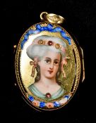 An unmarked gold enamel decorated locket One side with a glass panel,