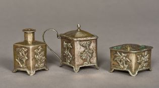 A Chinese unmarked silver three piece cruet Each of lozenge form with floral decorations.