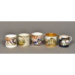 Five early 19th century porcelain coffee cans Variously decorated. The largest 6.5 cm high.