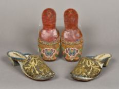 A pair of 19th century leather soled ladies slip on shoes With floral beadwork decorations;