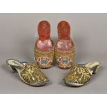 A pair of 19th century leather soled ladies slip on shoes With floral beadwork decorations;