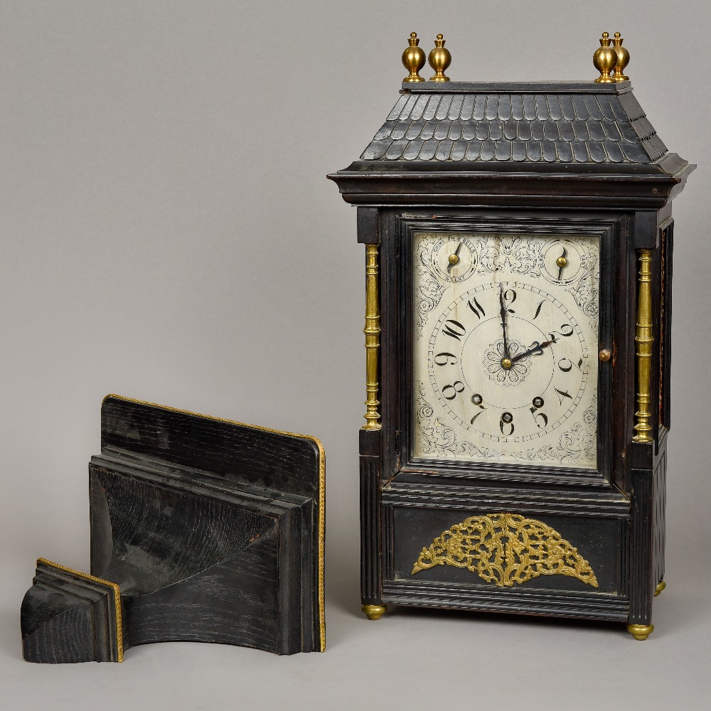 A 19th century Aesthetic ebonised bracket clock The engraved silvered dial with Arabic numerals,