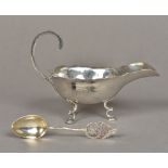 A Chinese silver sauce boat Of typical form, with scrolling handle,