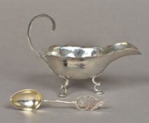 A Chinese silver sauce boat Of typical form, with scrolling handle,