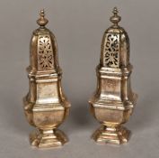 A pair of George V silver pepperettes, bearing Britannia Standard hallmarks probably for 1924,