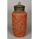 A Chinese porcelain jar and cover Worked to simulate cinnabar lacquer,