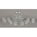 A Waterford cut crystal glass punch set Comprising: a large punch bowl and twelve punch glasses;