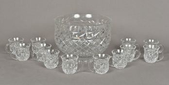 A Waterford cut crystal glass punch set Comprising: a large punch bowl and twelve punch glasses;