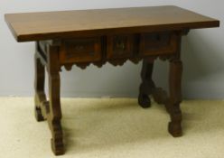 A 19th century Spanish walnut table The rectangular top above three moulded frieze drawers,