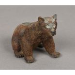 A Continental cold painted bronze figure of a bear Modelled seated. 9.5 cm high.