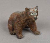 A Continental cold painted bronze figure of a bear Modelled seated. 9.5 cm high.