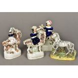 Four Staffordshire pottery groups Three modelled as female figures riding a goat; the other a zebra.