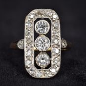 An Art Deco unmarked gold diamond set ring Of pierced canted rectangular form,