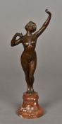 A bronze female nude Modelled stretching, standing on a carved hardstone plinth.