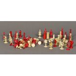 A collection of various 19th century ivory and stained ivory chess pieces Varying styles and sizes.