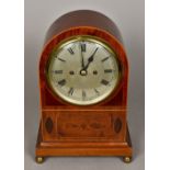 An Edwardian line inlaid mahogany mantel clock The silvered dial inscribed 142-Jays-144 Oxford St,