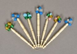 A quantity of Victorian turned bone and glass lace bobbins Of typical form. Various sizes.