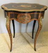 A 19th century French marquetry inlaid centre work table The serpentine top enclosing the fitted