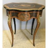 A 19th century French marquetry inlaid centre work table The serpentine top enclosing the fitted