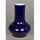 A Chinese porcelain baluster vase With allover blue glaze,