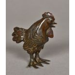 A 19th century Japanese patinated bronze model of a cockerel Naturalistically modelled standing.