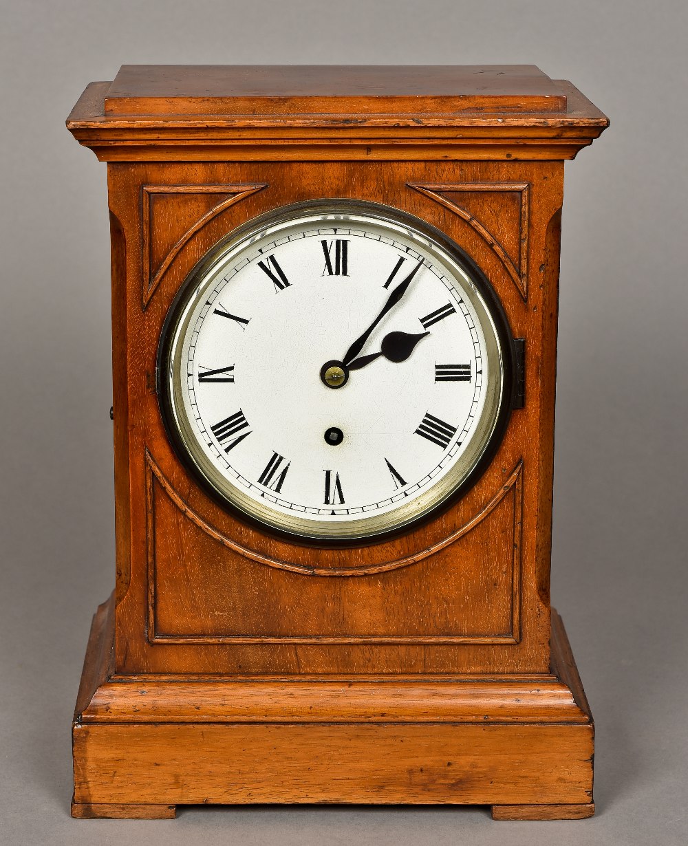 A Victorian mahogany mantel clock The moulded rectangular top above the white dial with Roman