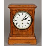 A Victorian mahogany mantel clock The moulded rectangular top above the white dial with Roman