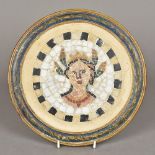 A framed circular mosaic panel The specimen stone roundel depicting a bust. 24 cm diameter.