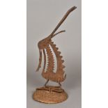 An African tribal, possibly Bambara People, wrought iron and basket weave headdress 45 cm high.