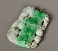 A Chinese carved jade pendant Formed as a bamboo stem. 6.5 cm high.