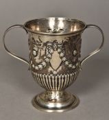 A George III silver twin handled cup, hallmarked London 1779,