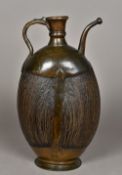 A large 18th century Middle Eastern ewer The main brass mounted body formed from a coco de mer. 44.