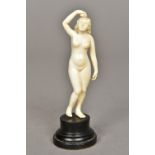 A small early 20th century ivory figurine Carved as a nude woman,