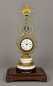 A Chinese gilt metal and coloured paste set mystery clock The 4 inch white painted dial with Roman