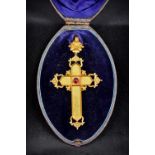 A Victorian unmarked gold crucifix form pendant/brooch Of pierced Gothic Revival design centred